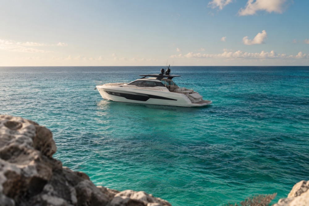 Private motor yacht on clear coastal water